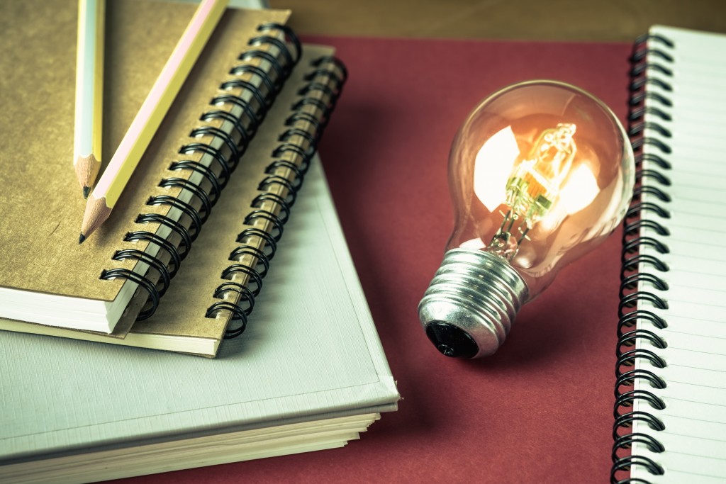 lightbulb with notebooks